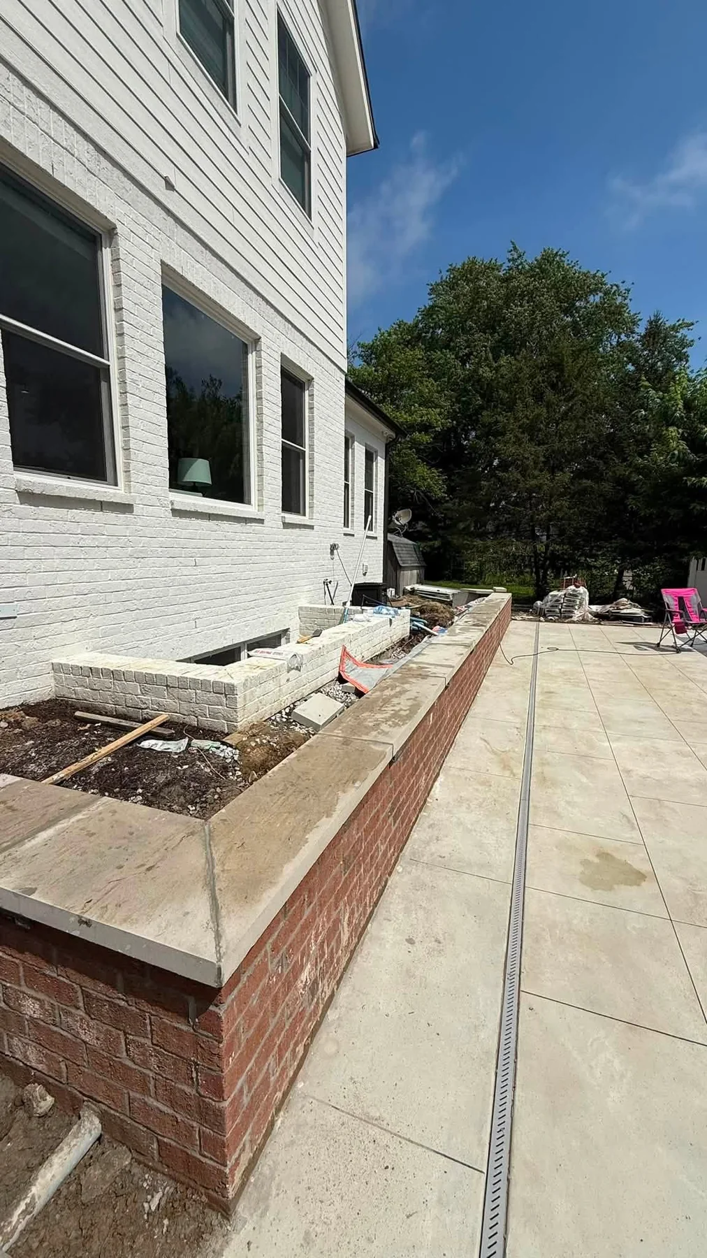 New concrete sidewalk beside a home