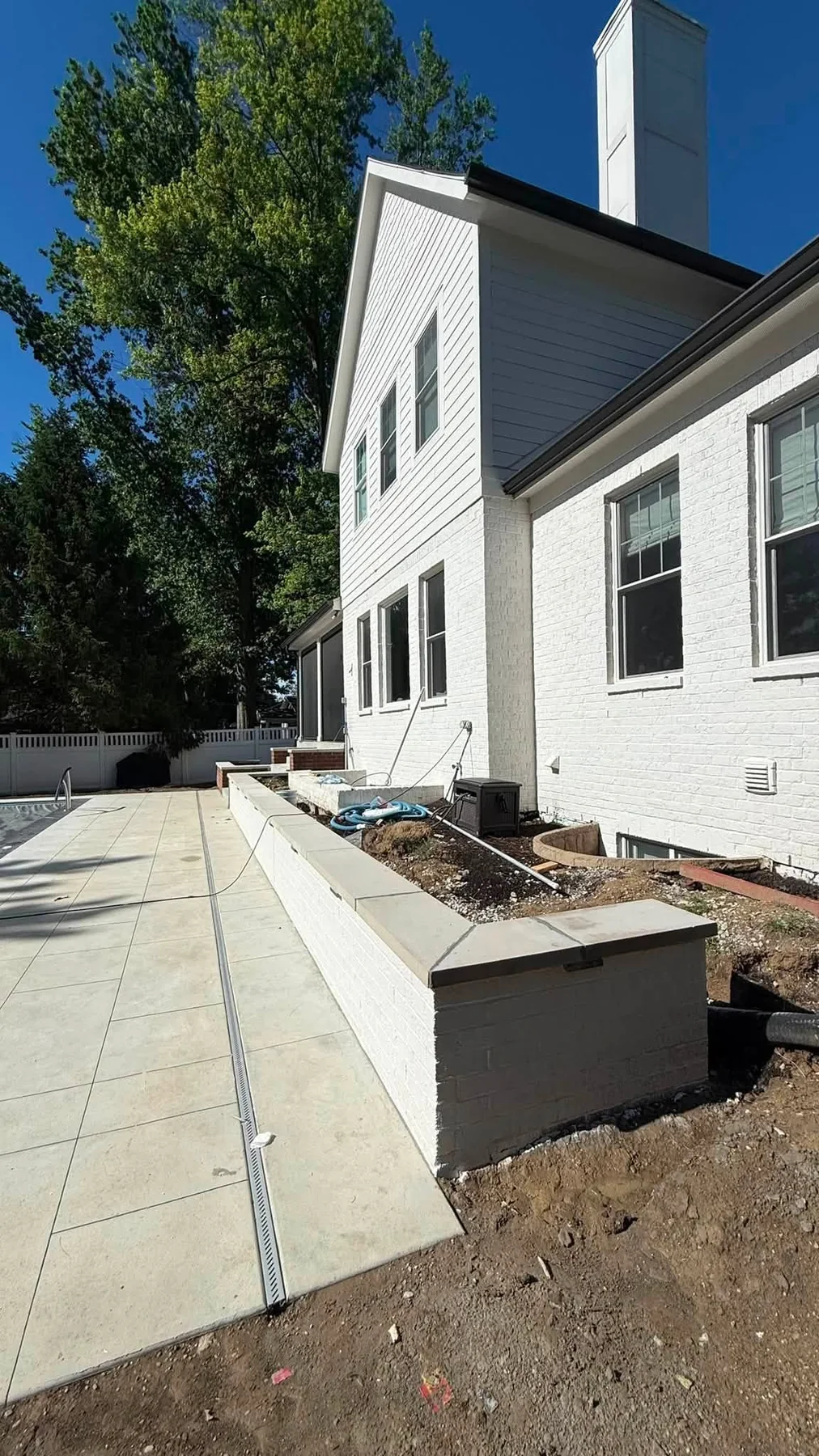 Concrete walkway beside a home